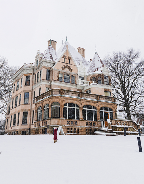 exterior view of a gilded age mansion